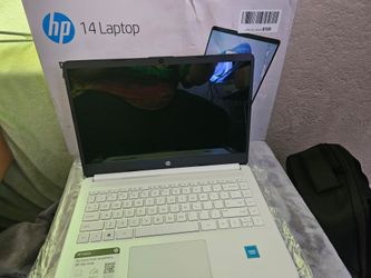 HP 14 Laptop (with an Intel Celeron processor, 4GB RAM, and 64GB eMMC storage) white