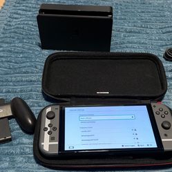 Nintendo switch Oled with docking station, charger and Joycon grip. No trades cash only.