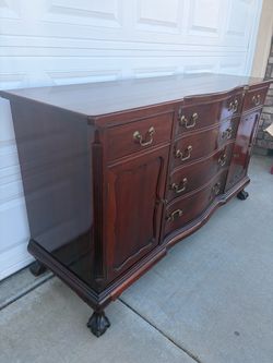 Cherry Wood Serpentine Dresser with Brass Hardware