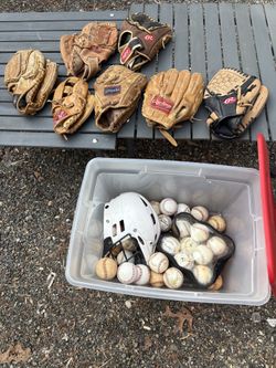 Baseball helmet, 31 baseballs and seven gloves