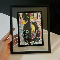 Eye-catching framed poster featuring a bold mash-up of the iconic March 2011 Vogue cover of Lady Gaga and KAWS’ signature Companion figure. Perfect