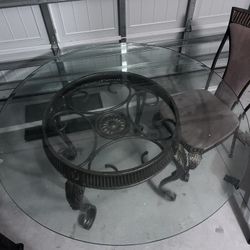 Large circular glass dining table with 4 chairs 