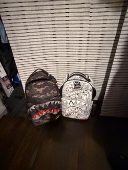 Spray ground camo and white art back packs