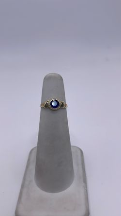 14k gold ring with blue CZ