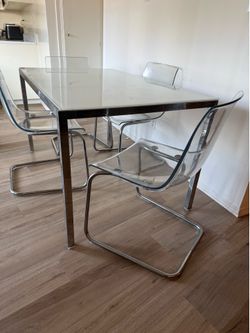Glass dining table and chairs set