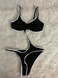 Black and white women’s swim wear one piece