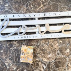 Sign Holds Pictures