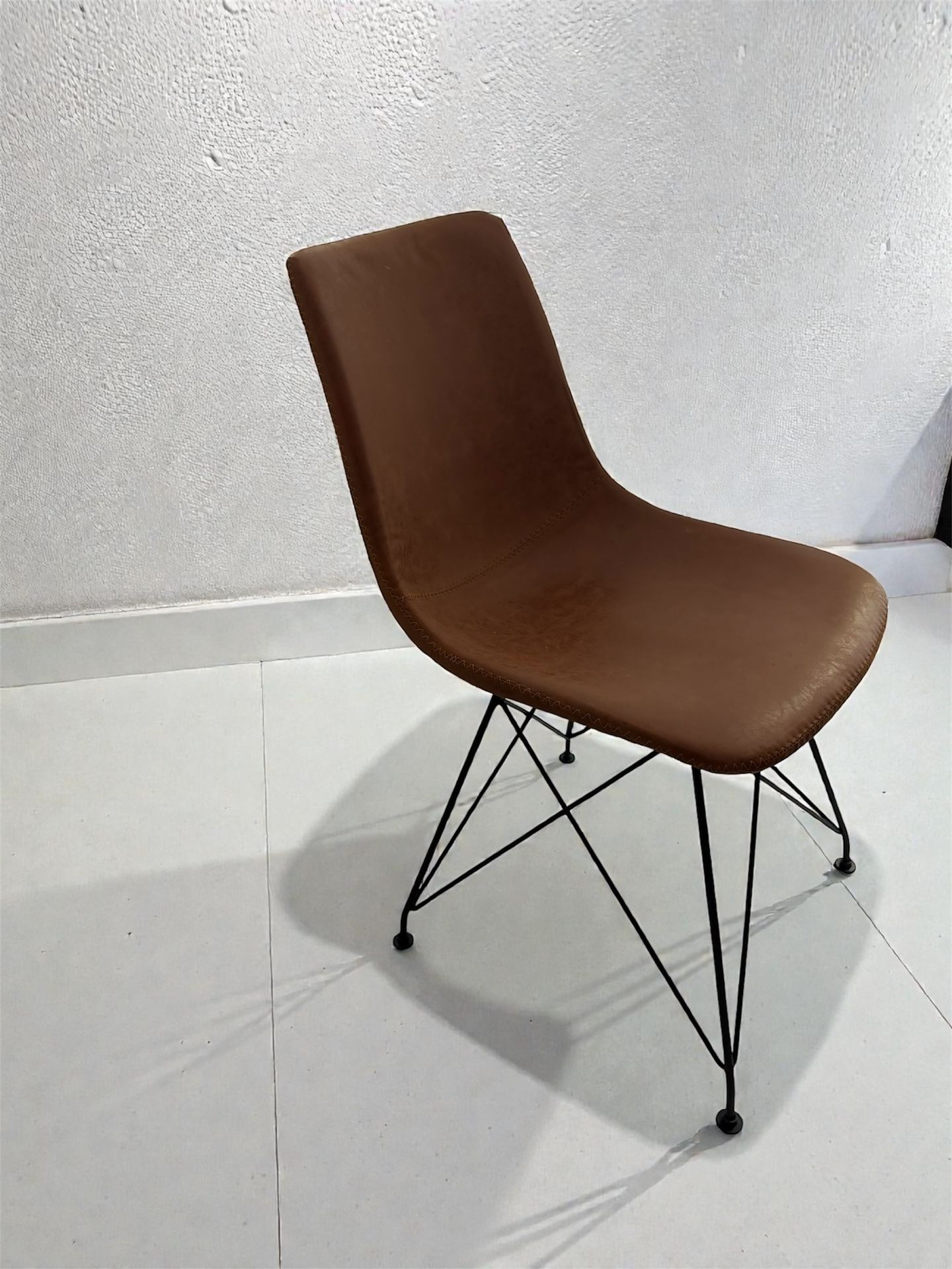 Two light brown leather chairs