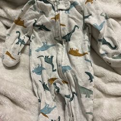 Box of new born baby clothes