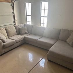 Living Spaces Sectional + Decorative Pillows
