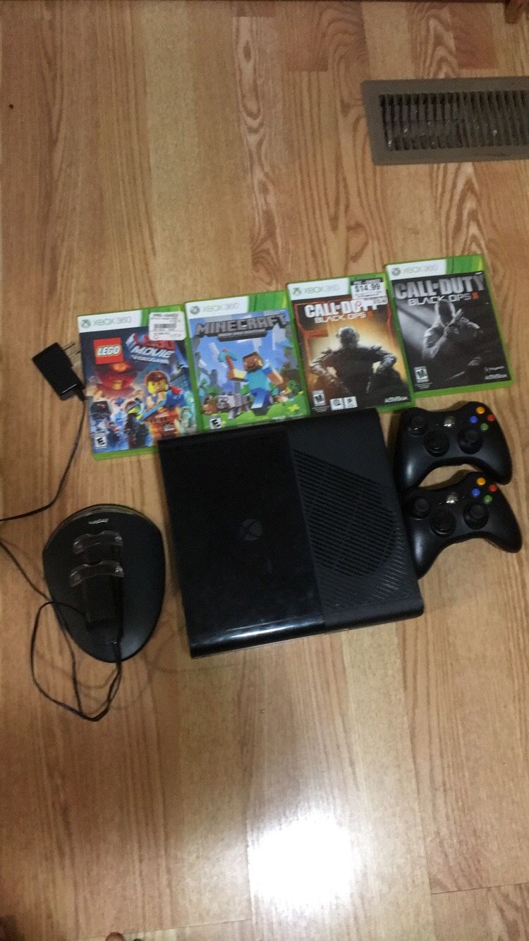 Xbox 360 and with 4 games plus with a charger with two controllers
