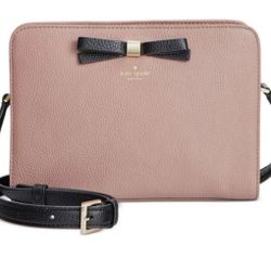 Pink Kate Spade New York leather crossbody bag with gold hardware and black bow detail #preppy #crossbody