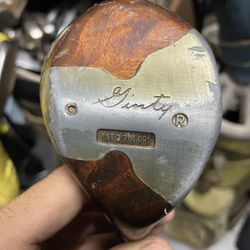 Vintage Stan Thompson Golf Club in right hand