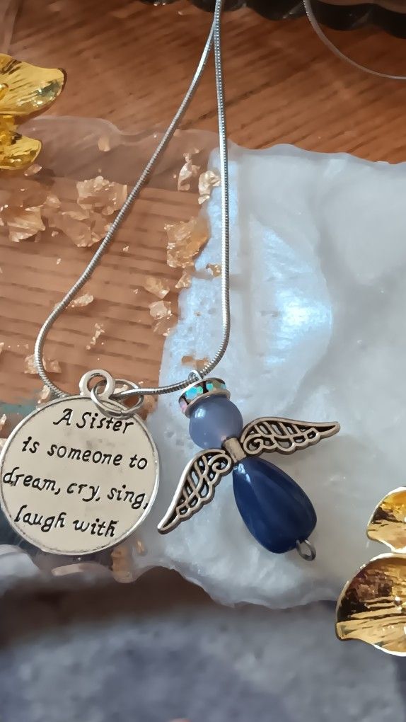 Angel And Sister Is Saying On Sliver Chain