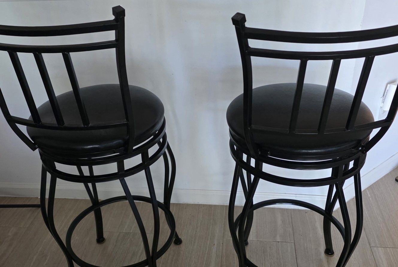 2 BLACK SWIVEL BAR STOOLS