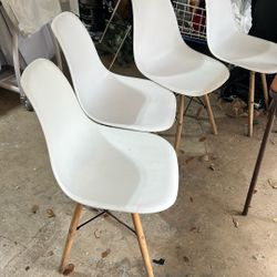 Plastic chairs with wooden and metal legs. The chairs are comfortable, wide and easy to clean. Cost: $40. $10 each