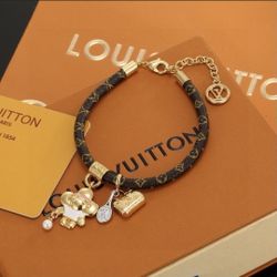 Luis Vuitton Monogram Charm Bracelet In Gold And Black 