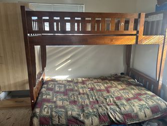 Bunk Bed Twin On Top, Full On Bottom Converts Into Futon Couch. With Futon Comes With Ladder To The Twin. 