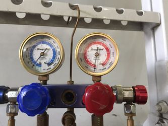 Manifold Gauge Set To charge up Air condition systems on cars made by Snap - On tools $180