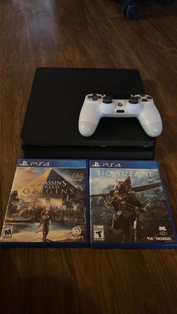 ps4 slim with a controller and 2 games