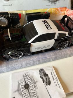 New in box. Damaged box. Battle Machine Radio Control 2006 Ford Gt Cop Car. $20.
