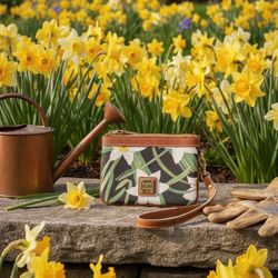 Dooney & Bourke Daffodil wristlet in white poly-coated leather