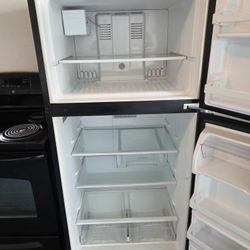 Black Whirlpool Refrigerator/Black GE Electric Stove 