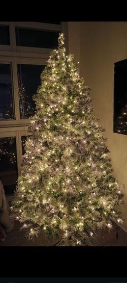 6ft Snow Flocked Pre-lit Christmas Tree with  Warm White Lights, $70