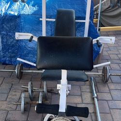 Weight bench with weights and barbell