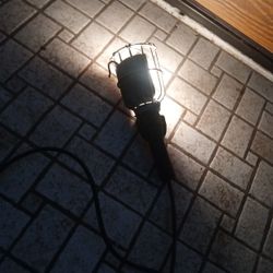 Electric Trouble Light With Metal Cage And Rubber Handle.