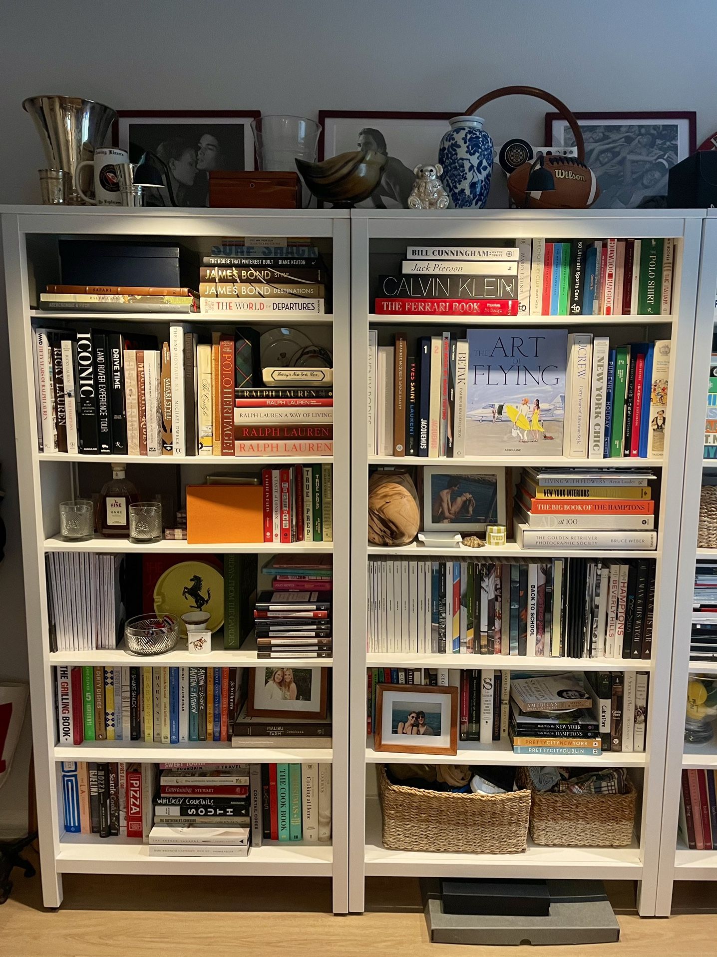 3 Large White Wood Bookshelves Each With Overhead Illuminating Lights