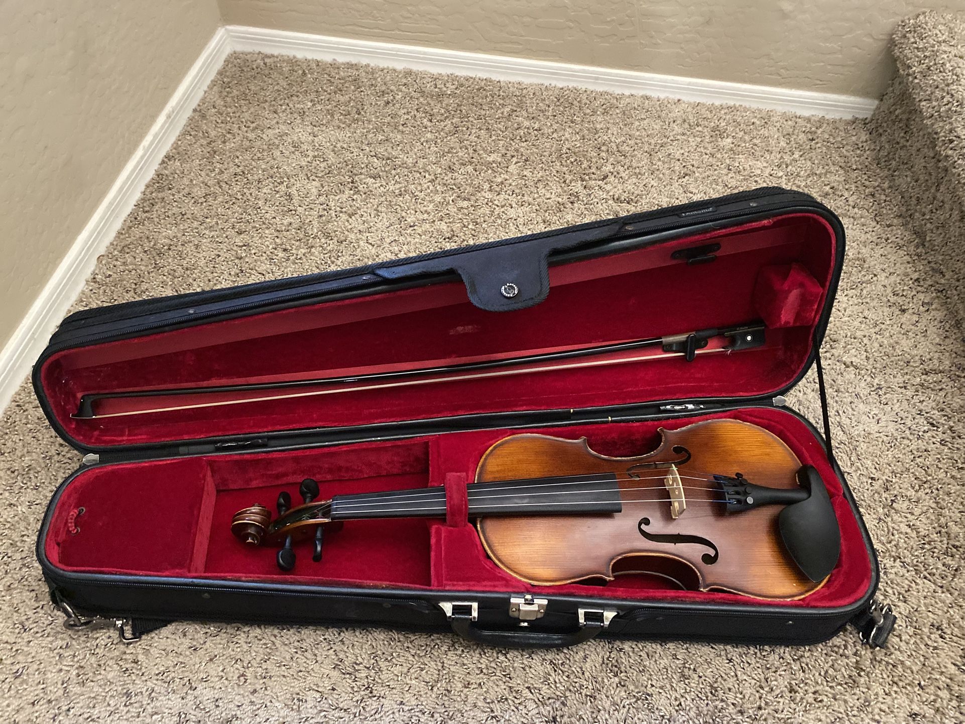 Violin-comes with extra strings. $100. Higley and ray.
