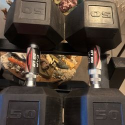 PAIR  OF NEW  RUBBER   HEX  50  LB.  DUMBBELLS