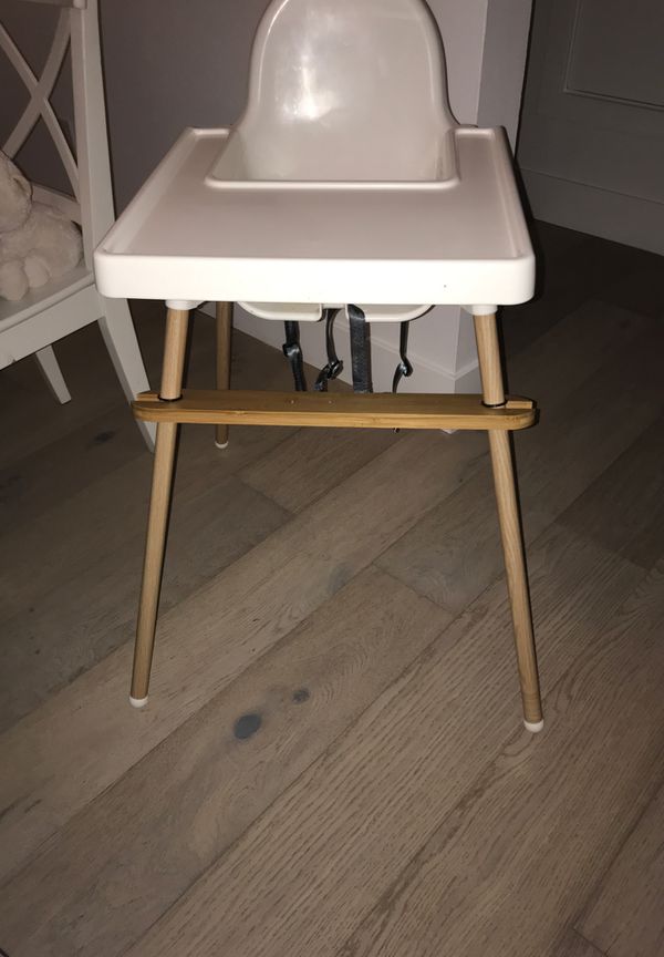 IKEA high chair with wood legs and wood foot rest for Sale