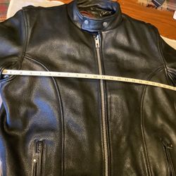 Leather motorcycle jacket by Jamin Leather size medium Harley Davidson  all working zippers and snaps, 100% leather with removal liner Harley Davidson