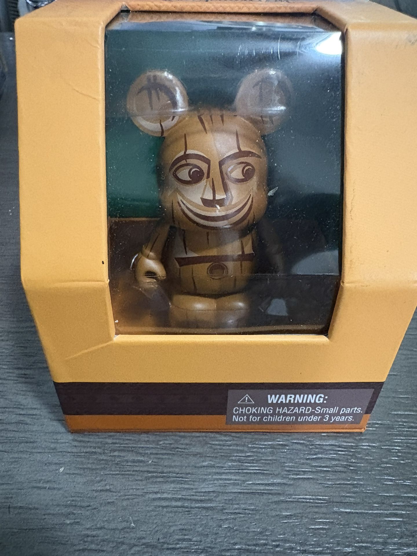 The product is a Disney Aulani Hawaii Vinylmation Menehune figure.