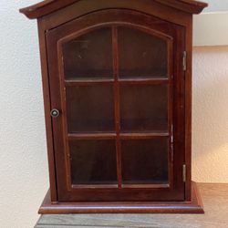 wood armoire with glass door
