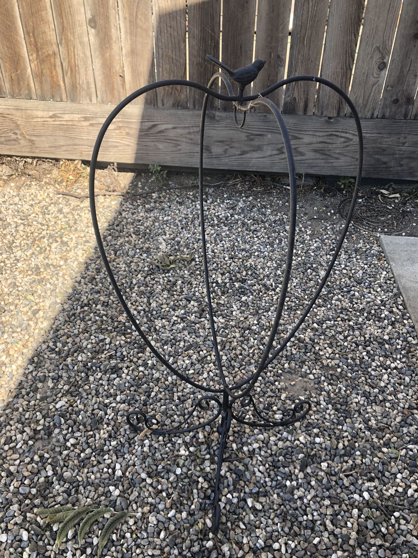Outdoor decor. Black metal heart plant stand for hanging plant