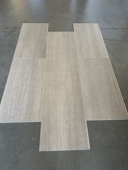 Waterproof Luxury Plank 12"x24" Click W/Pad @ $2. 49/sf 