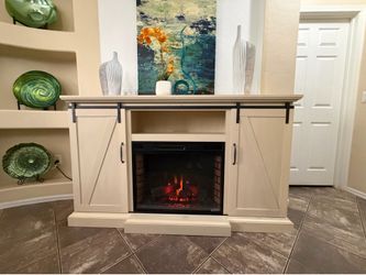 Beautiful farmhouse fireplace /tv stand with sliding barn doors in excellent condition