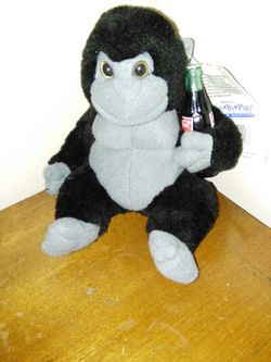 7" PLUSH GORILLA HOLDING A COCA-COLA BOTTLE.