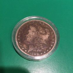 1889 O MORGAN SILVER DOLLAR.