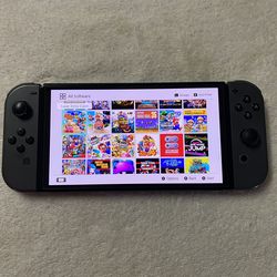 NINTENDO SWITCH OLED + 125 SWITCH GAMES and 7500 CLASSIC GAMES