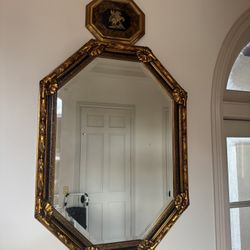 antique Napoleon III style octagonal wall mirror with an ornate gilded frame