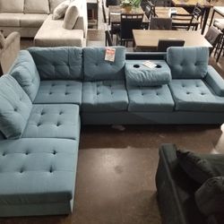Blue fabric sectional with a drop down leaf