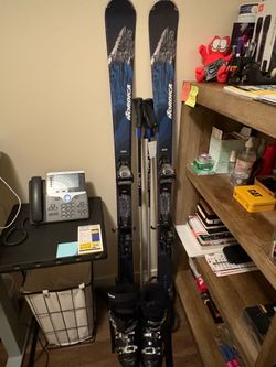 Nordica 158 skis with boots and poles