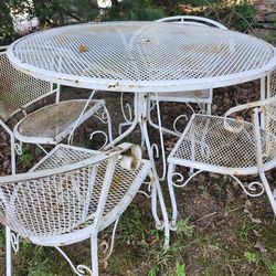 Cast Iron table with  4 chairs  selling all for 195
