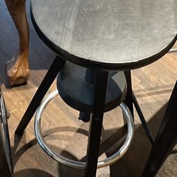 Small black with metal foot rest bar stool /
