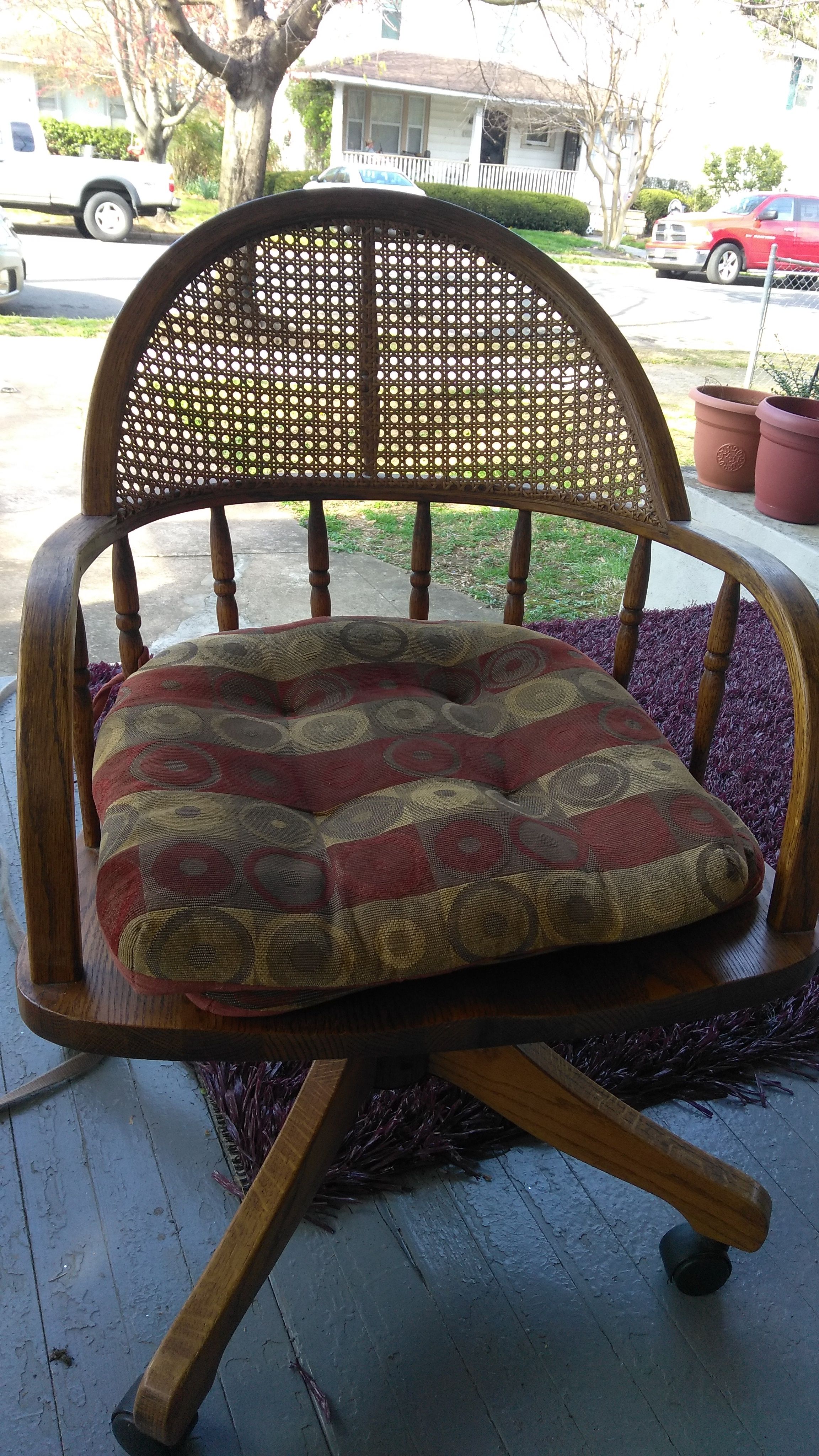 Nice wooden chair, with cushions and rollers