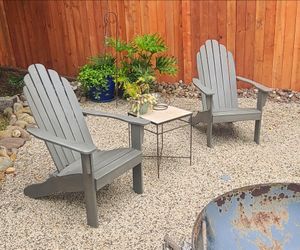Two Gray Adirondack Chairs